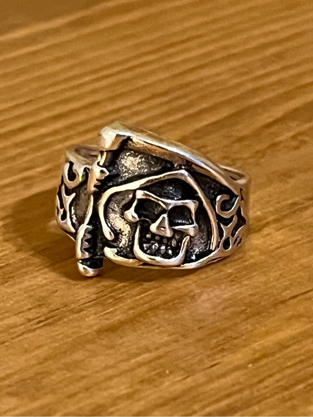 Jolly old pirate ring with intricate engravings on a silver tone band size 7 1/2